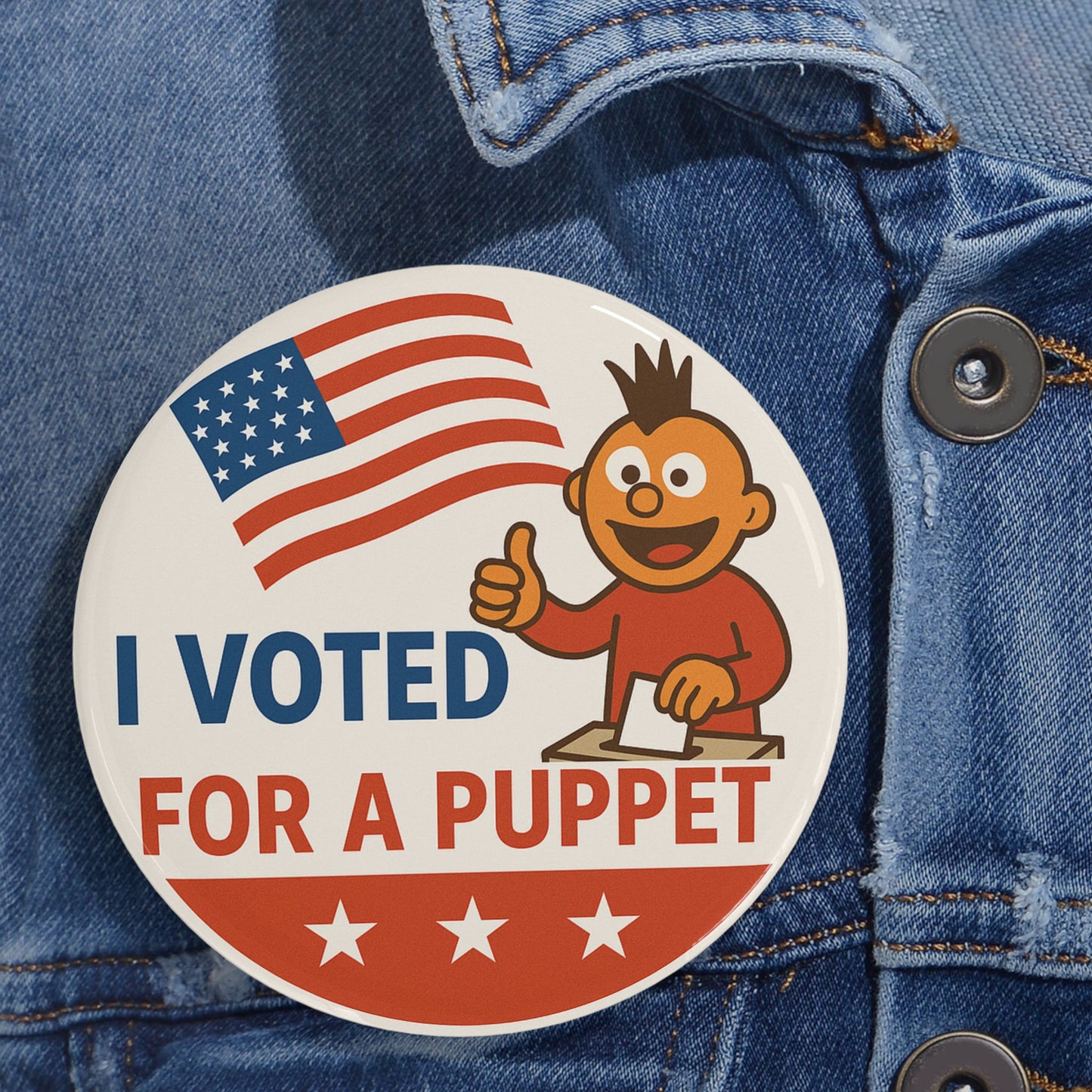 Button with 'I Voted For A Puppet' text and American flag on a denim background